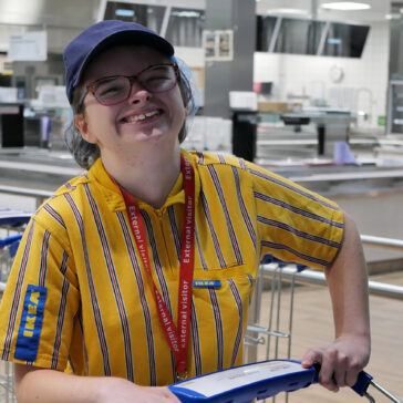 College student in IKEA uniform smiling in the IKEA restaurant