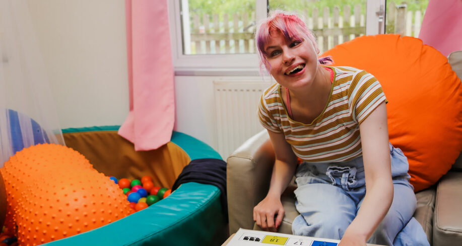 Young lady on couch enjoying a speech and language therapy session