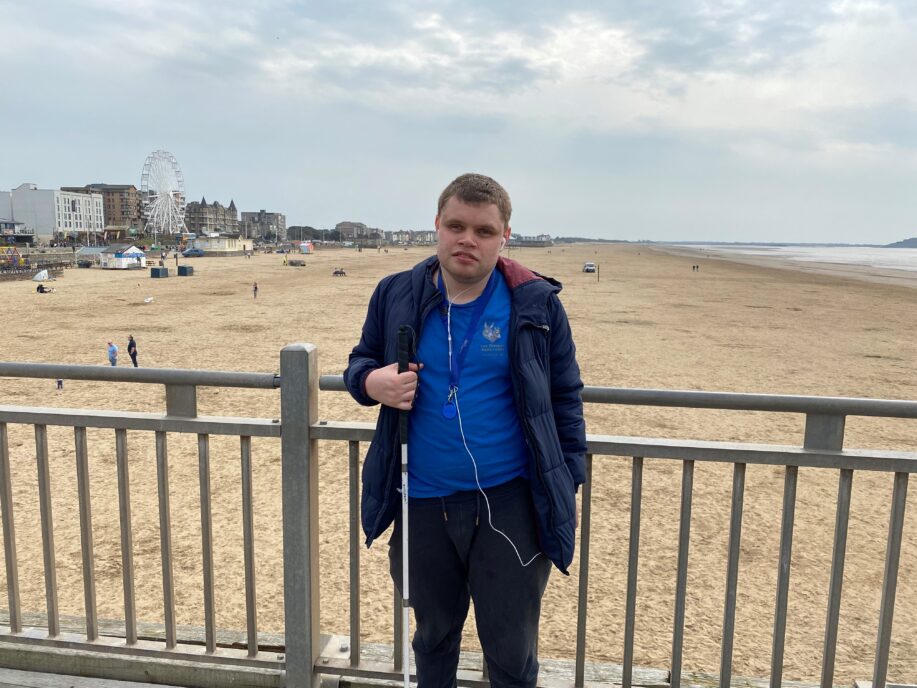 George stood on the pier holding his cane