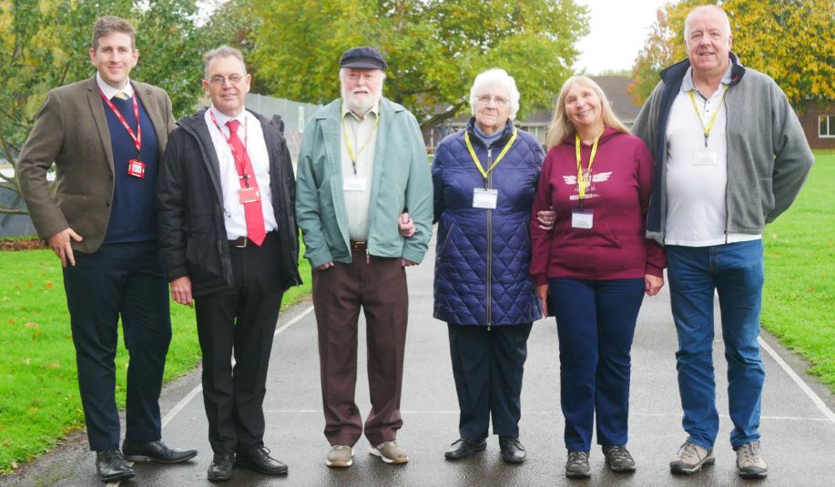 Group photo of former pupil, Glenda, with family, school friend, and Laurence