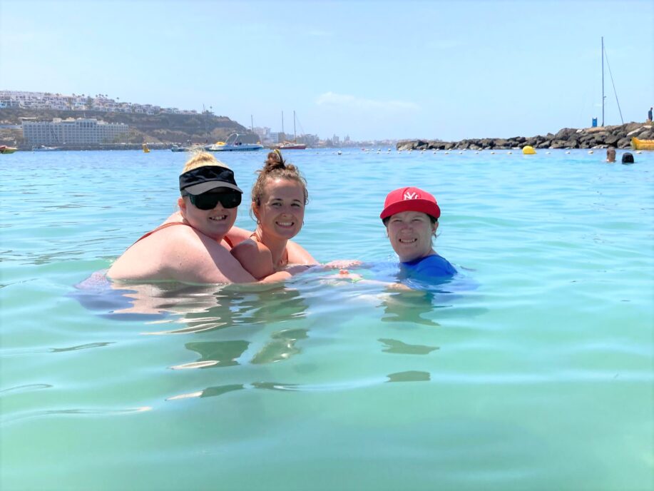 two students and a member of staff in the sea in Gran Canaria