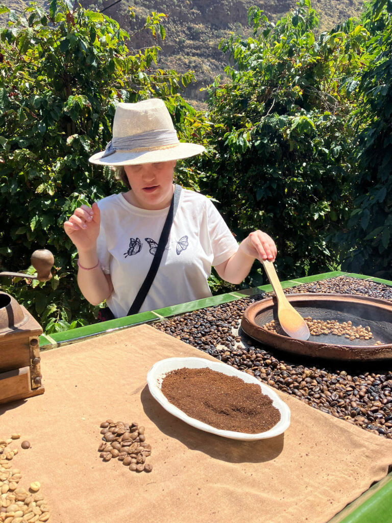 Student toasting coffee beans in the hills of Gran Canaria