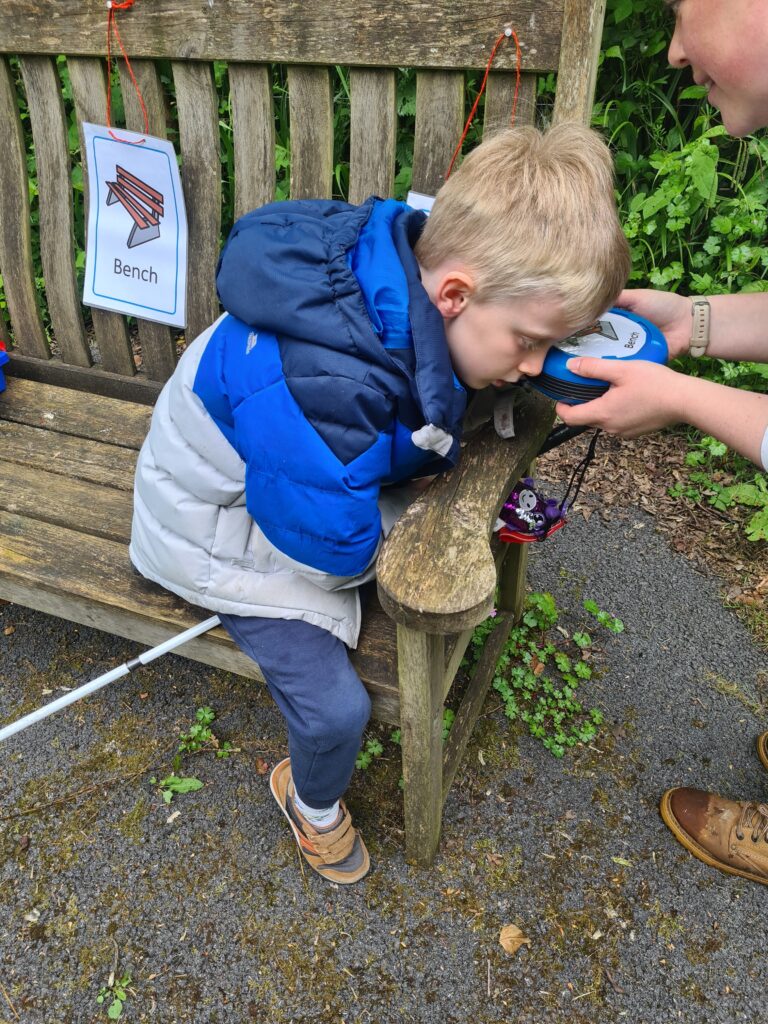 Child listening to sounds from sensory switch.