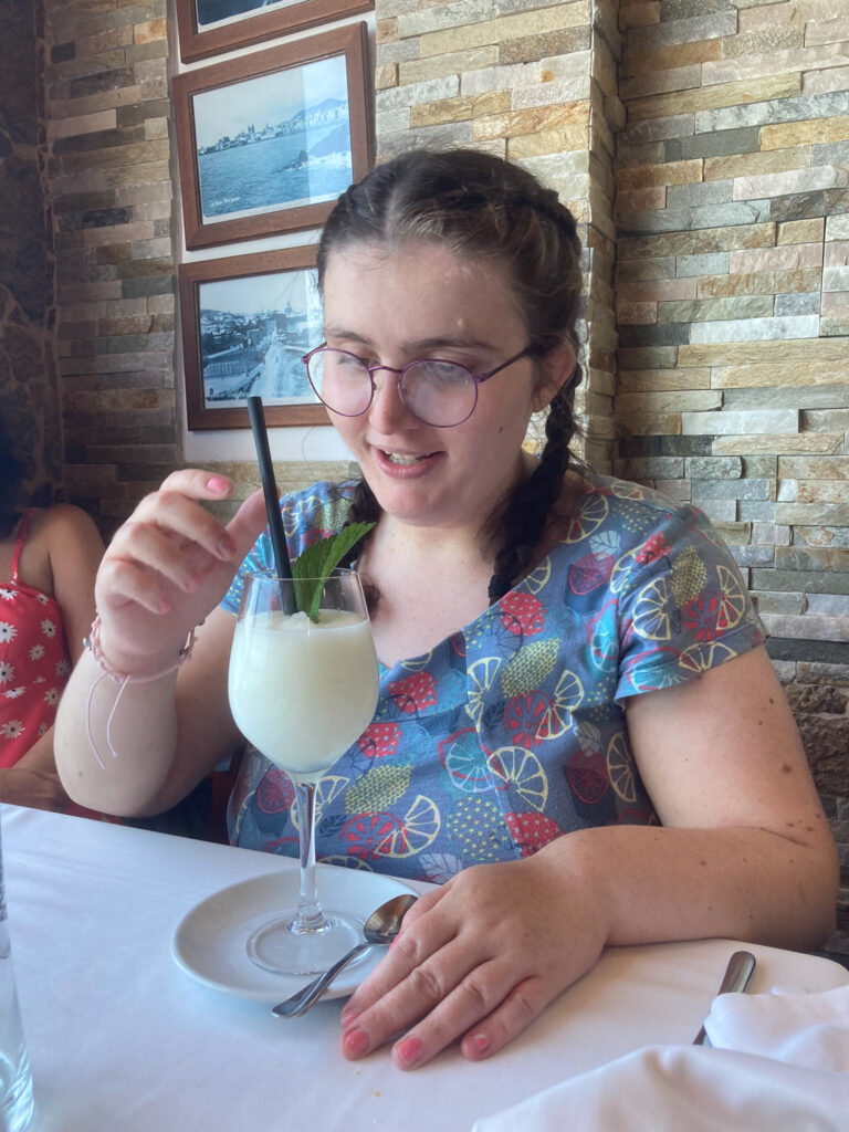 A young woman with a lime green desert.