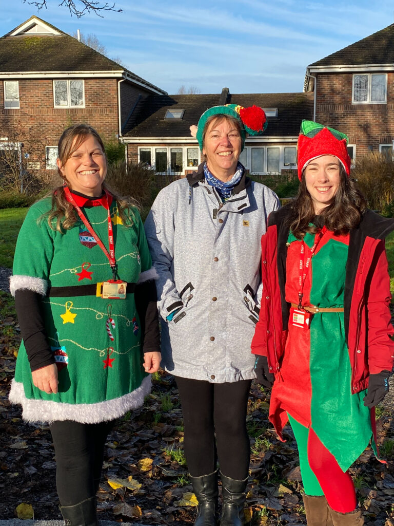 Three InFocus staff members dressed as elves