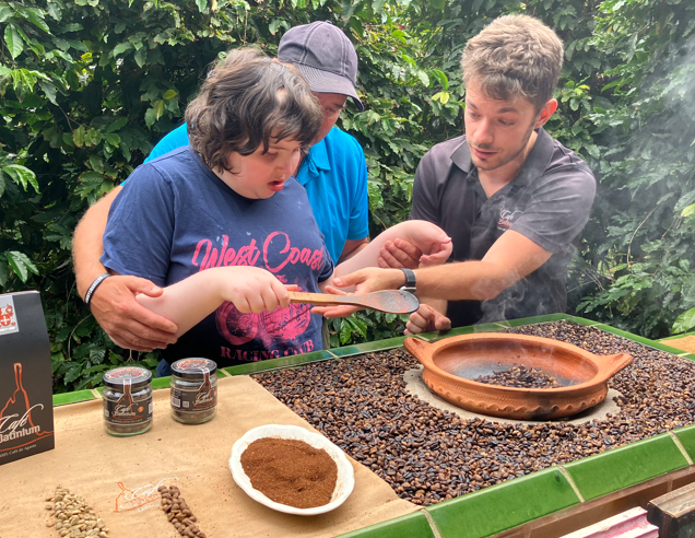 a student being helped to toast coffee beans